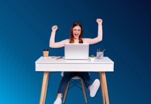 Generation Z girl excited on computer