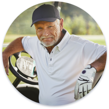 An old man in a golf car