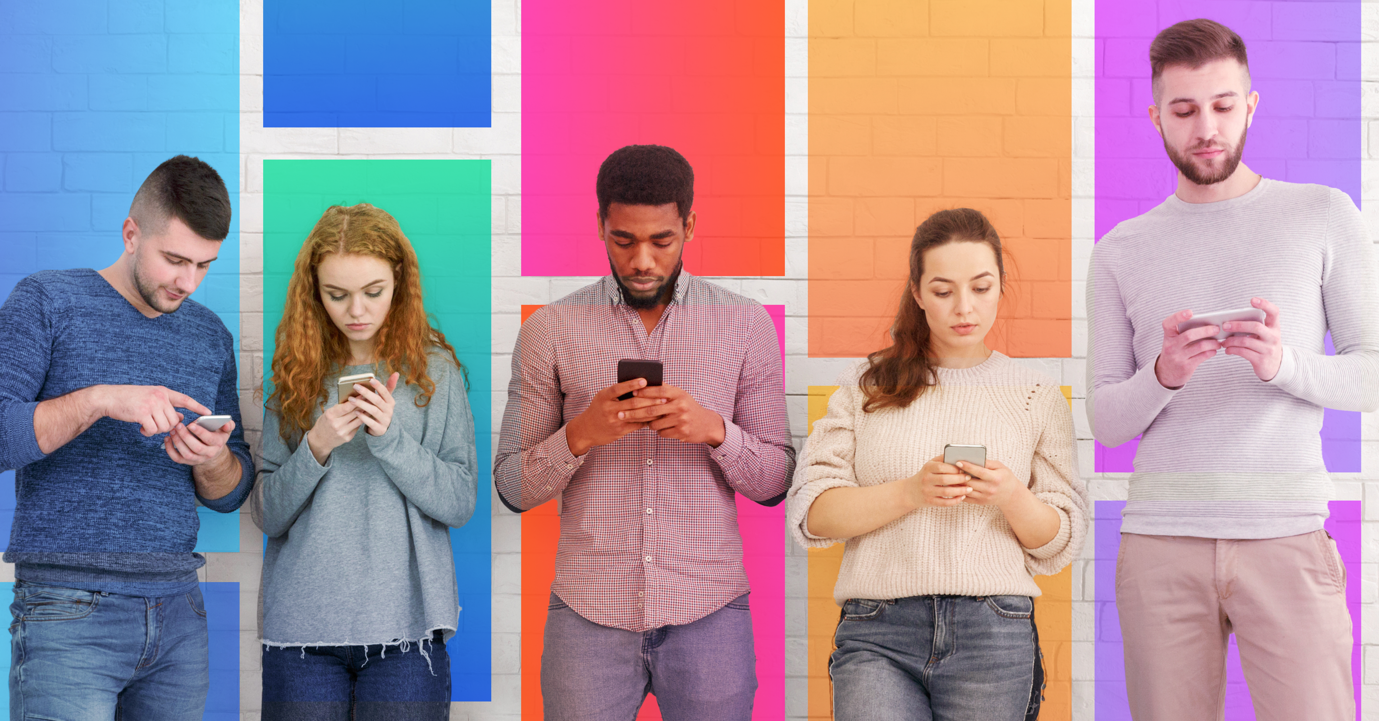 Multiple young people standing in front of a coloured background looking at their phones